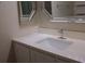 Bright bathroom vanity featuring a modern sink, faucet, and stylish mirrors at 911 N Orange Ave # 335, Orlando, FL 32801