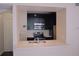 Well-equipped kitchen offering black cabinetry, a stainless steel oven, and a breakfast bar at 911 N Orange Ave # 335, Orlando, FL 32801