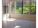 Bright living room featuring multiple windows offering ample natural light and beautiful outdoor views at 911 N Orange Ave # 335, Orlando, FL 32801