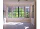 Inviting living room with a ceiling fan, hardwood floors, a large window and neutral colored walls at 911 N Orange Ave # 335, Orlando, FL 32801