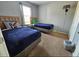 Inviting bedroom with two twin beds, a window with curtains and wall mounted lamp at 1022 Calabria Ave, Davenport, FL 33897