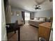 Spacious main bedroom with neutral colors, plush carpeting, and a ceiling fan at 1022 Calabria Ave, Davenport, FL 33897