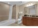 Bathroom featuring a tiled shower/tub, a sink with vanity, and modern fixtures at 1100 Sunset View Cir # 204, Reunion, FL 34747