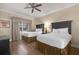 Bright bedroom featuring two beds, a ceiling fan, and comfortable furnishings at 1100 Sunset View Cir # 204, Reunion, FL 34747