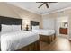 Bright bedroom offering two beds, wood-look floors, and ample closet space at 1100 Sunset View Cir # 204, Reunion, FL 34747