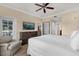 Bedroom featuring wood-look floors, a ceiling fan, and comfortable seating at 1100 Sunset View Cir # 204, Reunion, FL 34747