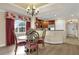 Dining area featuring a round glass-top table and chairs, a chandelier, and hardwood floors at 1100 Sunset View Cir # 204, Reunion, FL 34747