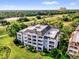 A beautiful condominium building is surrounded by lush landscaping and scenic views at 1100 Sunset View Cir # 204, Reunion, FL 34747