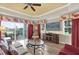 Cozy living room featuring hardwood floors, a ceiling fan, comfortable seating, and access to the outdoor patio at 1100 Sunset View Cir # 204, Reunion, FL 34747