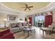 Bright living room featuring a ceiling fan, neutral tones, and sliding glass doors to the outdoor patio at 1100 Sunset View Cir # 204, Reunion, FL 34747
