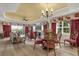 Open living space with dining area featuring hardwood floors, neutral walls, and a ceiling fan at 1100 Sunset View Cir # 204, Reunion, FL 34747