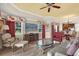 Spacious living area featuring hardwood floors, neutral walls, a ceiling fan, and a dining area at 1100 Sunset View Cir # 204, Reunion, FL 34747