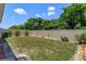 Fenced backyard with freshly cut grass, mature trees, and easy to maintain landscaping at 1287 Berry Ln, Davenport, FL 33837