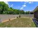 Fenced backyard with grass and brick features easy to maintain landscaping at 1287 Berry Ln, Davenport, FL 33837