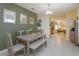 Inviting dining area with table, seating, and view of the kitchen and living room at 1287 Berry Ln, Davenport, FL 33837