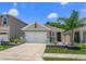 Charming single-Gathering home with a well-manicured lawn, inviting entry, and two-car garage at 1287 Berry Ln, Davenport, FL 33837