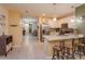Open-concept kitchen with modern island, stainless steel appliances, and views of the dining area at 1287 Berry Ln, Davenport, FL 33837