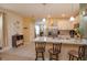 Spacious kitchen with island seating, stainless steel appliances, and modern countertops at 1287 Berry Ln, Davenport, FL 33837