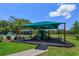 Community playground with sunshade features play equipment and easy access at 1287 Berry Ln, Davenport, FL 33837