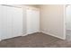 Bedroom featuring carpet and a closet with white bi-fold doors at 1322 Reagans Reserve Blvd, Apopka, FL 32712