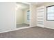 Bedroom with large mirror, built-in bookcase, and neutral carpet at 1322 Reagans Reserve Blvd, Apopka, FL 32712