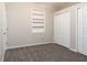 Bedroom featuring carpet, an open shelf, and a closet with white bi-fold doors at 1322 Reagans Reserve Blvd, Apopka, FL 32712