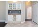 Open dining area featuring built-in cabinets, wine rack, and decorative backsplash at 1322 Reagans Reserve Blvd, Apopka, FL 32712