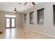 Spacious living room with tile flooring, glass patio doors, and windows with blinds at 1322 Reagans Reserve Blvd, Apopka, FL 32712