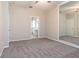 Spacious carpeted main bedroom leading to a well-lit en suite bathroom at 1322 Reagans Reserve Blvd, Apopka, FL 32712