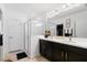 Elegant bathroom with double vanity, sleek countertops, and a glass-enclosed shower at 14357 Hidden Ct, Clermont, FL 34711