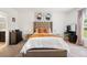 Inviting bedroom with a large bed, modern decor, and plenty of natural light at 14357 Hidden Ct, Clermont, FL 34711