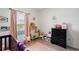 Delightful Bedroom space featuring whimsical decor, a mini kitchen set, and soft, inviting textures at 14357 Hidden Ct, Clermont, FL 34711