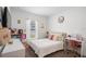 Bright bedroom with a cozy bed, stylish desk, and ample storage, perfect for a or teen at 14357 Hidden Ct, Clermont, FL 34711