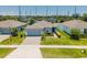 Lovely one-story home boasts a lush green lawn and attached garage in suburban neighborhood at 14357 Hidden Ct, Clermont, FL 34711