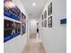 Bright hallway adorned with artwork, connecting different areas of the home at 14357 Hidden Ct, Clermont, FL 34711