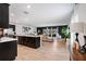 Bright living room featuring an open concept layout, modern decor, and seamless flow into the kitchen at 14357 Hidden Ct, Clermont, FL 34711