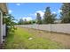Large backyard featuring well-maintained lawn and a stylish fence, creating a serene and private outdoor space at 150 Mitchell Creek Way, Oviedo, FL 32765