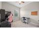 Bedroom with window, desk, chair, and carpeted flooring at 150 Mitchell Creek Way, Oviedo, FL 32765