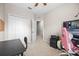 Spacious bedroom with a closet, desk, chair, ceiling fan and carpet at 150 Mitchell Creek Way, Oviedo, FL 32765