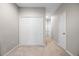 Bedroom featuring neutral walls and carpet, a closet, and access to additional rooms at 150 Mitchell Creek Way, Oviedo, FL 32765