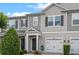 Charming townhome featuring neutral tones, a single-car garage, and well-maintained landscaping at 150 Mitchell Creek Way, Oviedo, FL 32765