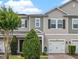 Charming townhome featuring neutral tones, a single-car garage, and well-maintained landscaping at 150 Mitchell Creek Way, Oviedo, FL 32765