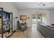 Cozy living room area leads out through sliding glass doors to the backyard at 150 Mitchell Creek Way, Oviedo, FL 32765