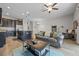 Open floorplan with kitchen and living room, featuring dark wood cabinets and tile flooring at 150 Mitchell Creek Way, Oviedo, FL 32765
