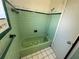 Quaint bathroom showcases a green tub with white star-shaped tile accents on the front panel at 1506 Carmen Ave, Daytona Beach, FL 32117