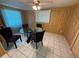 Inviting dining room with a glass table and four comfortable chairs at 1506 Carmen Ave, Daytona Beach, FL 32117