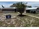 Charming house with front yard, carport, and 'For Sale' sign at 1506 Carmen Ave, Daytona Beach, FL 32117