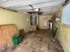 View of the home's empty garage with storage and access to interior at 1506 Carmen Ave, Daytona Beach, FL 32117