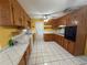 Spacious kitchen featuring a full suite of appliances and tile flooring at 1506 Carmen Ave, Daytona Beach, FL 32117