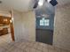 View of living room with tile floors leading to carpeted area and textured walls at 1506 Carmen Ave, Daytona Beach, FL 32117
